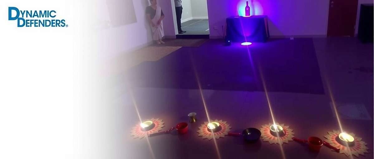 Dynamic Defenders Diwali Event showing rangoli and diyas